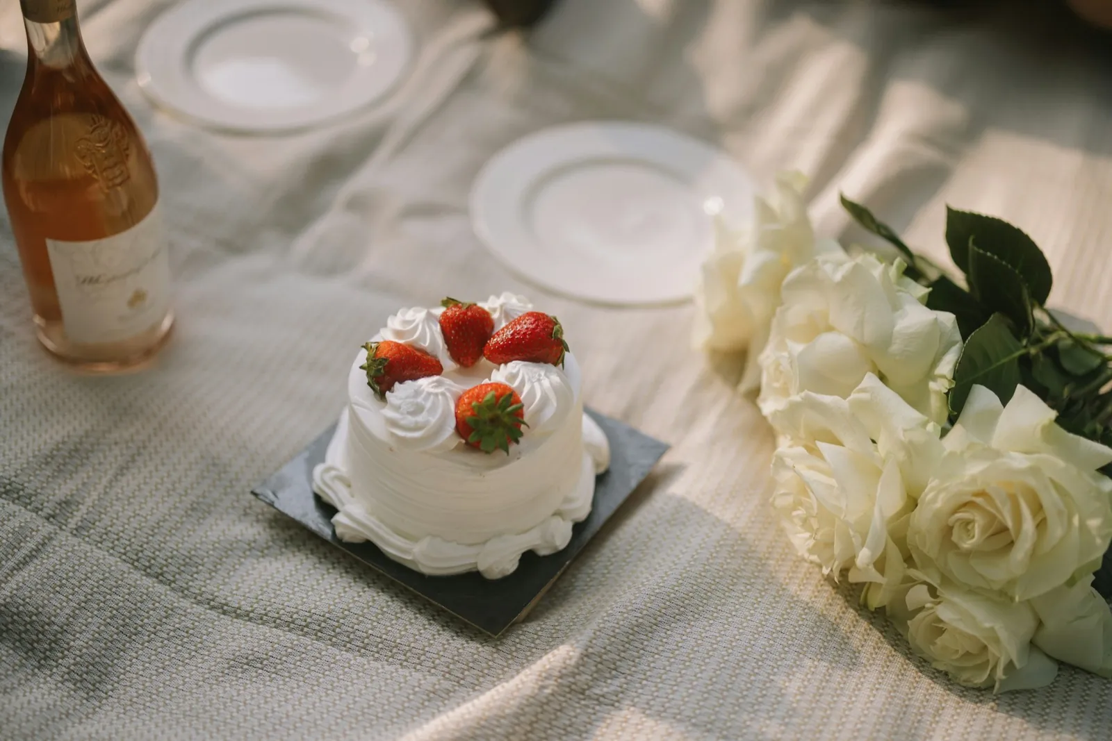 A small celebration cake with strawberries